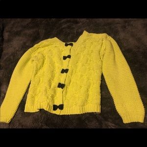Bright sweater with bows on back size L